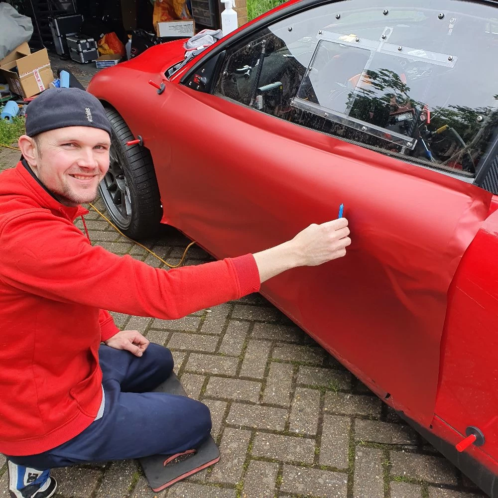 fiba motorsport photo of owner with red mitsubishi eclipse